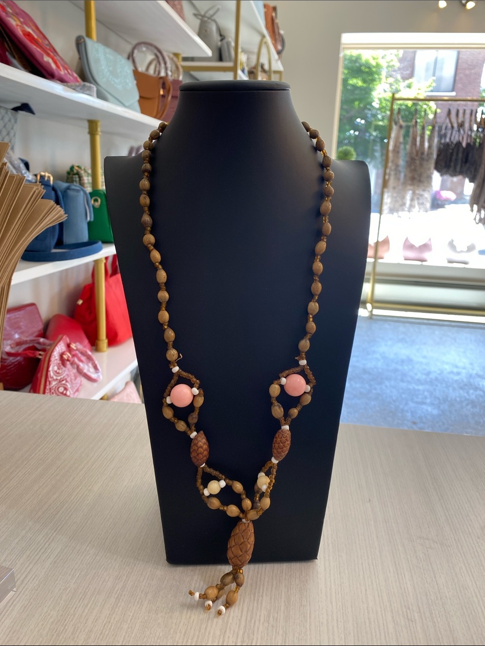 Handcrafted Brown Beaded Necklace with Pink Accents